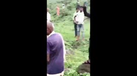 Python wraps itself around Indian's man neck as he goes to toilet in bushes