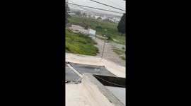 Box Truck Drivers Through Flooded Road