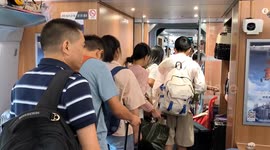 China: Passengers Get off A Train at the West Station of the high-speed railway in Fuyang