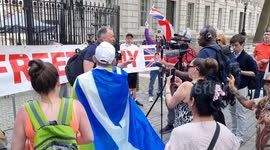 Tommy Robinson supporters gather at 10 Downing Street demanding his release after being arrested under terror laws