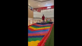 Person skates on donut-like object and falls in Cilegon, Indonesia