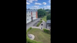 12-year-old rides scooter in dinosaur costume in Skövde, Sweden