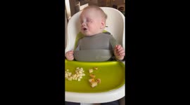 Sleep vs. dinner: Little guy battles his way through a plate of food