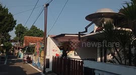 Indonesia: A UFO-shaped art installation is seen in one of the houses in UFO Village in Mantrijeron District