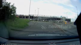 Close Call: Reckless White Ford Fiesta Nearly Collides with Dash Cam Car on Roundabout!