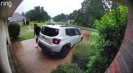 Woman Runs Into Garage Door While Trying to Protect Hair