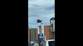 Protesters pull down Maduro billboard amid election outrage in Venezuela