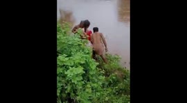 Elderly grandmother crosses swollen river in cooking pot to reach to hospital