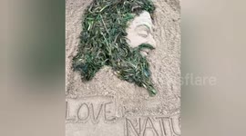 Sand Artist created a beautiful sand art from the drifted sea weeds which came due to monsoon with theme