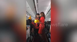 Cabin crews give birthday surprise to passenger