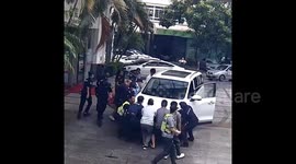 Alert bystanders and police lift car to rescue child trapped underneath in China