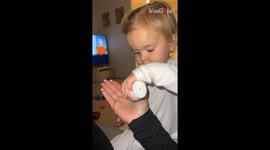 Adorable babies take turns giving their mom comforting hand massage