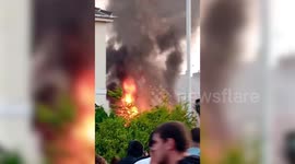Police van on fire outside mosque in Southport, UK