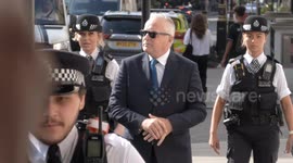 Photographer hurled to the ground as Huw Edwards runs media gauntlet to court with police escort
