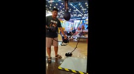 Person slips and falls while attempting punching machine in Yogyakarta, Indonesia