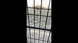 Rat perches on gate to evade floods in Marikina, Philippines