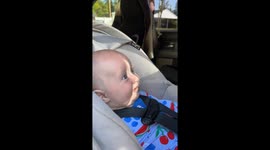Clown and baby share a heartwarming moment during a road trip break