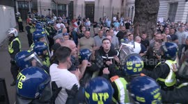 Police officer punches protester during arrest at violent London demo