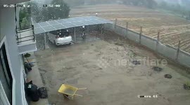 Garden wall collapses while being battered by rain