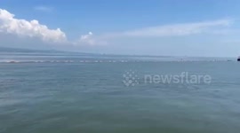 Containment boom installed as Philippines races to control spreading oil spill