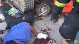Cyclist narrowly escapes serious injury after getting trapped under lorry in China