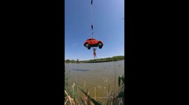 Man holds onto suspended car until plunging into water in Rostov-on-D