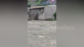 Lucky escape for pedestrians after raging torrent washes away road foundations
