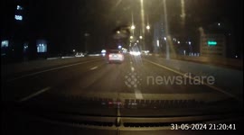 A speeding Tesla narrowly overtakes a driver, then road rages by brake checking and swerving around on the highway late at night.