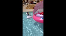 Stylish baby celebrates pool day by chilling in her inflatable float