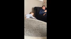 Clever 2 y/o boy makes a move for cash while Dad is clueless on the couch