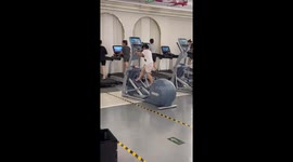 Toddler has creative way to use cross-fit machine at gym