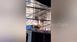 Building fire 'caused by gas tank leak in restaurant' kills 11