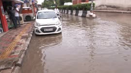 Buildings collapsed and roads submerged as devastating rains hit Delhi