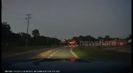 Turning Car Drives Directly Into Oncoming Truck's Headlights