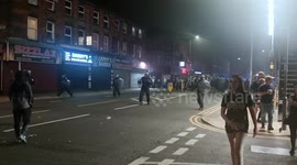 Riot Police face ‘protesters’ back as disorder breaks out on County Road, Walton, Liverpool L4 Merseyside