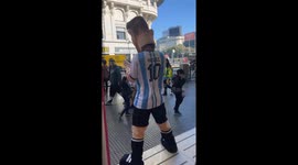 Person in Messi costume dances on Buenos Aires street