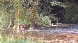 Water rescue team save driver trapped in car engulfed by river