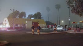 USA: Car Flies off 101 Freeway Landing in Wienerschnitzel Parking Lot