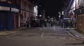 Person sprays water to protect home from nearby car fire amid Hartlepool riots