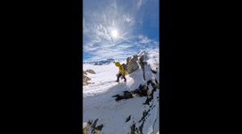 Climber navigates narrow path atop French Alps