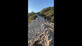 Biker falls at Cristal Cove Beach while avoiding collision