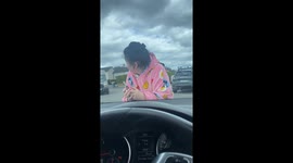 Driver carries person on car hood in South Dublin, Ireland