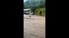 Video shows rescue of person swept by flood waters in Buenos Aires, Argentina