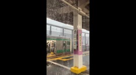 Rainwater drips through ceiling of train station during heavy downpour