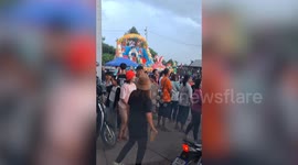 Bouncy castle topples over with children inside