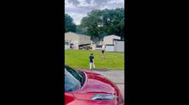 Unexpected fun: Toy airplane lands on grandma's back during joyful playtime