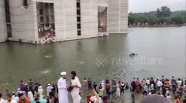 Bangladesh protesters celebrate in Dhaka lake as PM announces resignation