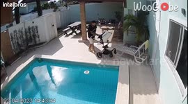 Dad tumbles over a baby stroller and retrieves it from mishap instantly