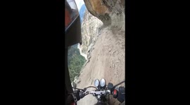 Motorcycle ride on cliff edge in Jammu, Kashmir