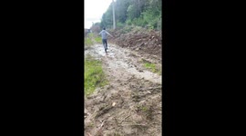 Chile: person slips in mud, washes off in stream